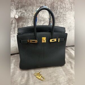 Hermes Black Satchel with Gold Accents